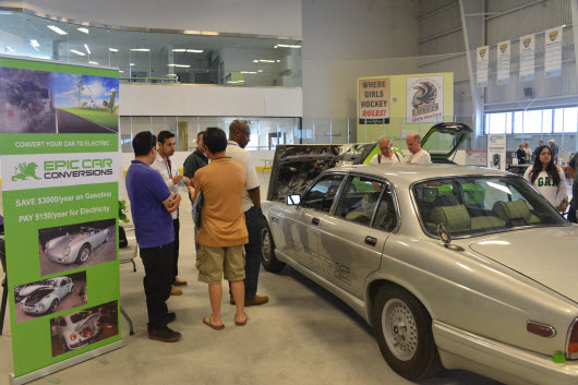 A View of Epic Car Conversion Jaguar EV and visitors digging for EV Conversion Information at EV Fest 2014